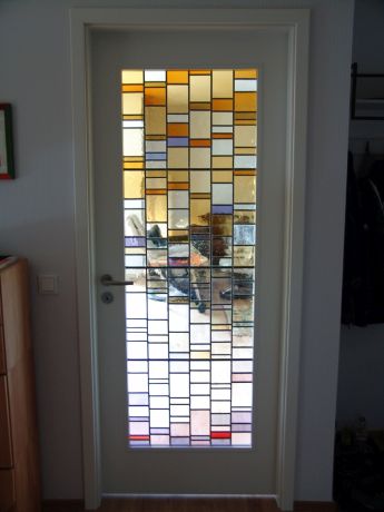 Glas in lood geplaatst in deur