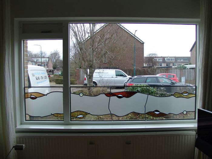 Glas in lood binnen tegen isolatieglas geplaatst