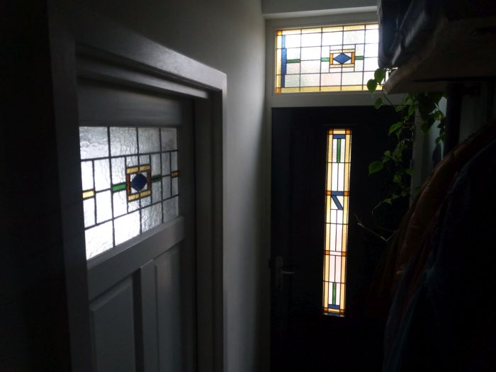 Glas in lood in isolatieglas in huisdeur en bovenlicht