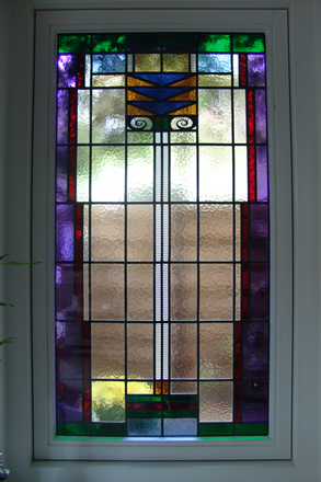 Nieuw glas-in-lood in isolatieglas in buitengevel