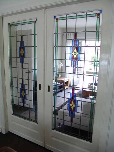 <br>Bijpassend glas in lood in kamer en suite